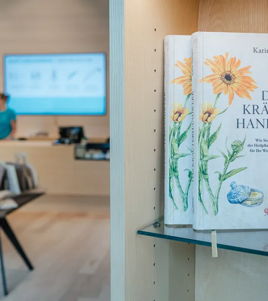 Herbal craft book with floral cover on store shelf promoting natural healing methods